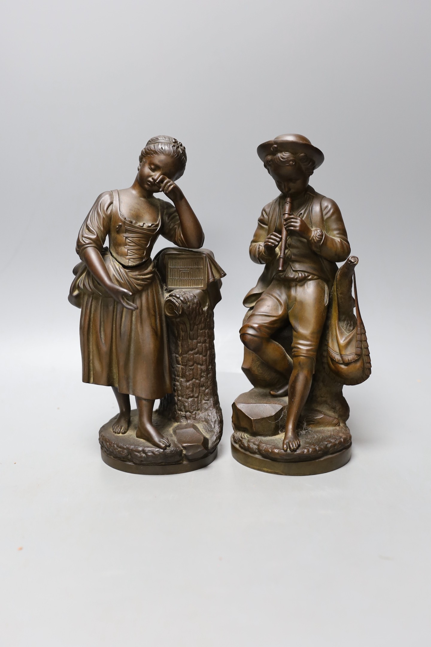 A pair of 19th century bronze figures of children, 24cm